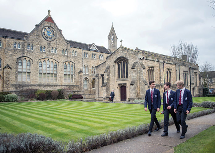 Boys walking by campus